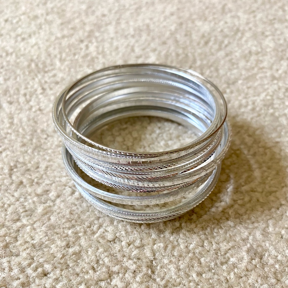 Stack of Silver Bangle Bracelets